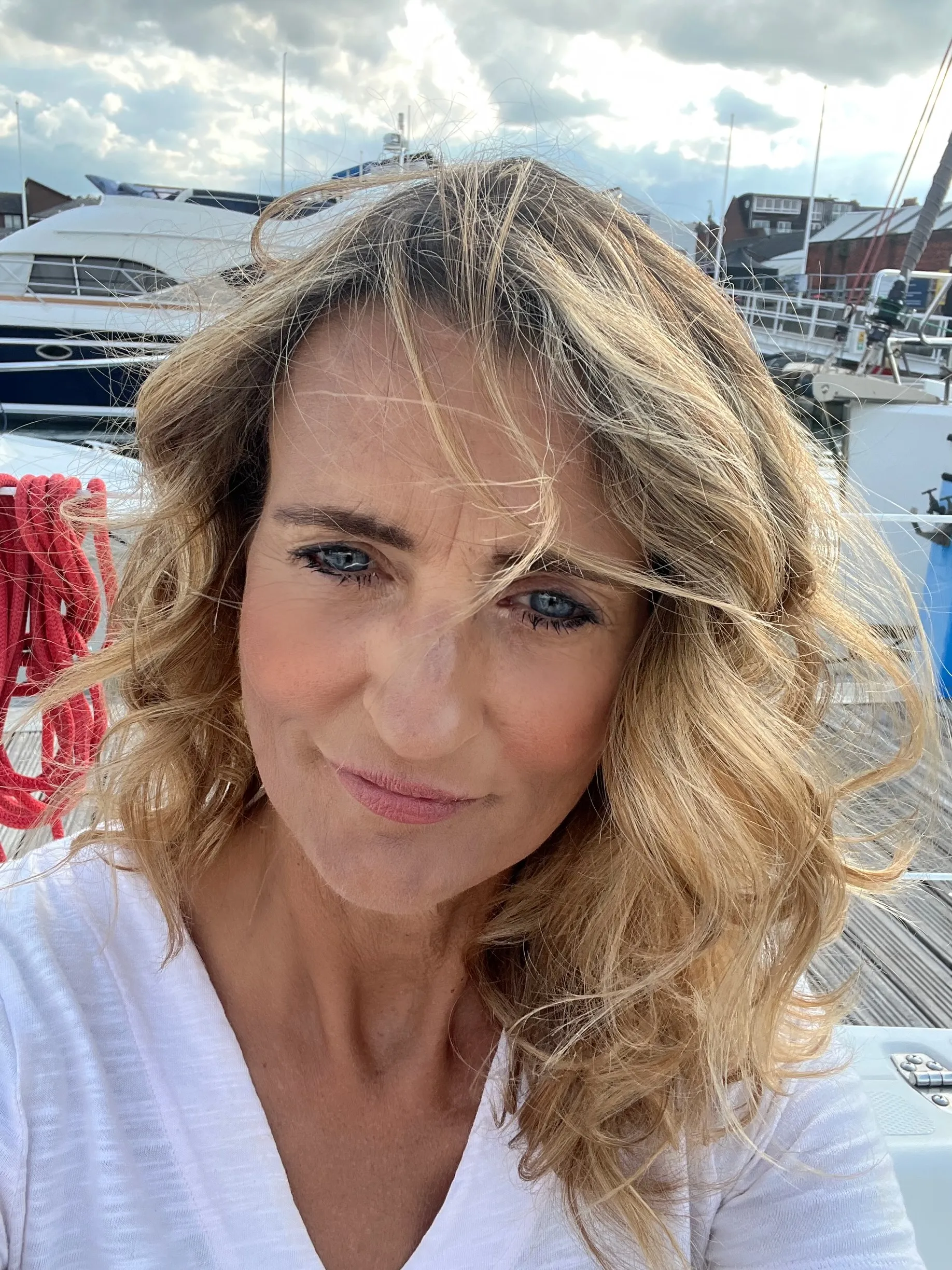 A profile photo of Claire at a marina.