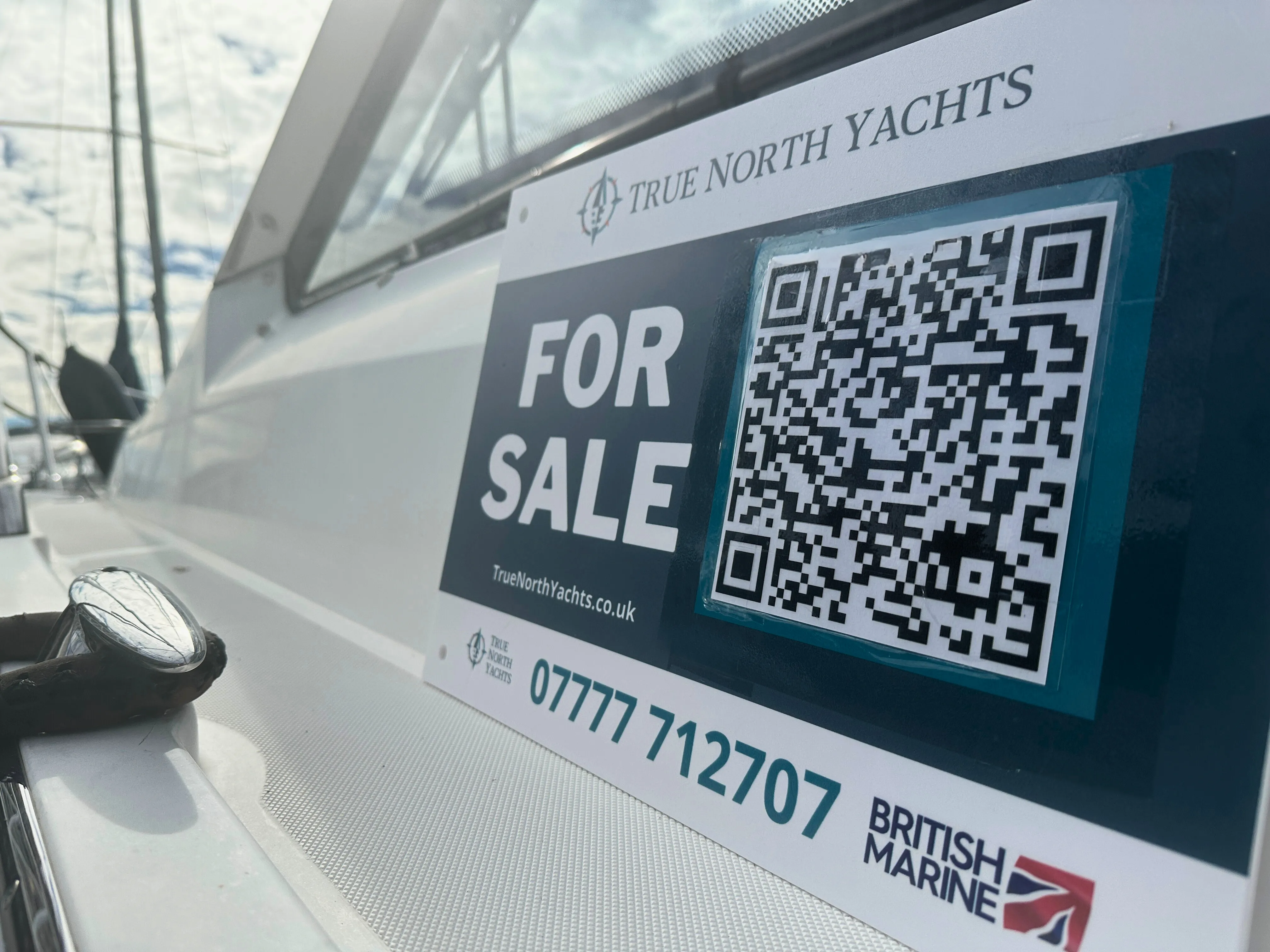 The Hull of a boat that has been beached for painting.